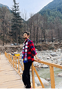 Hiker on a mountain bridge